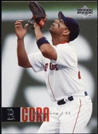 A baseball player holding a glove

Description automatically generated